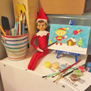 elf on the shelf with painting 
