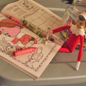 elf on shelf with coloring book