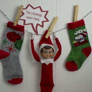 elf on the shelf with christmas socks