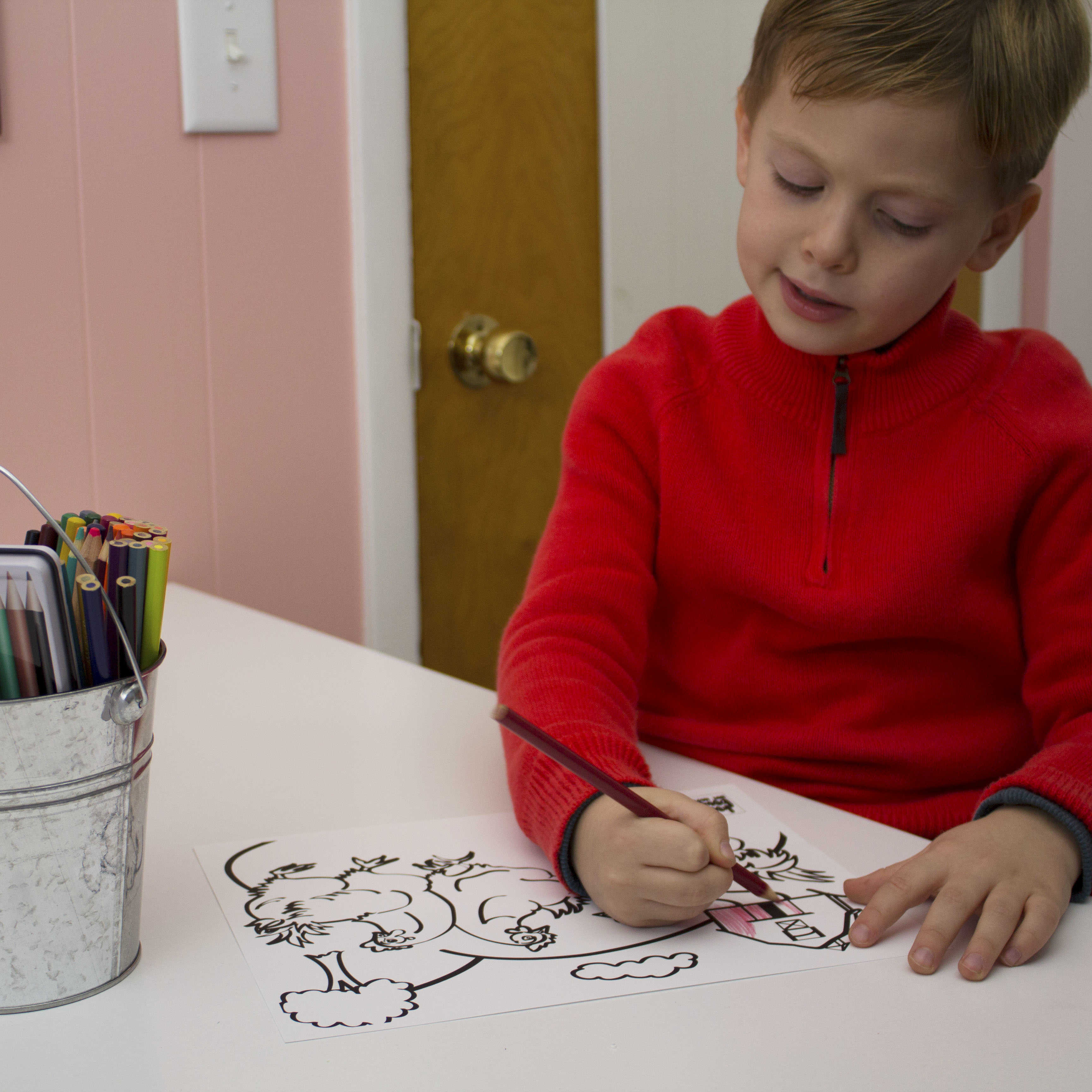 boy using colored pencils