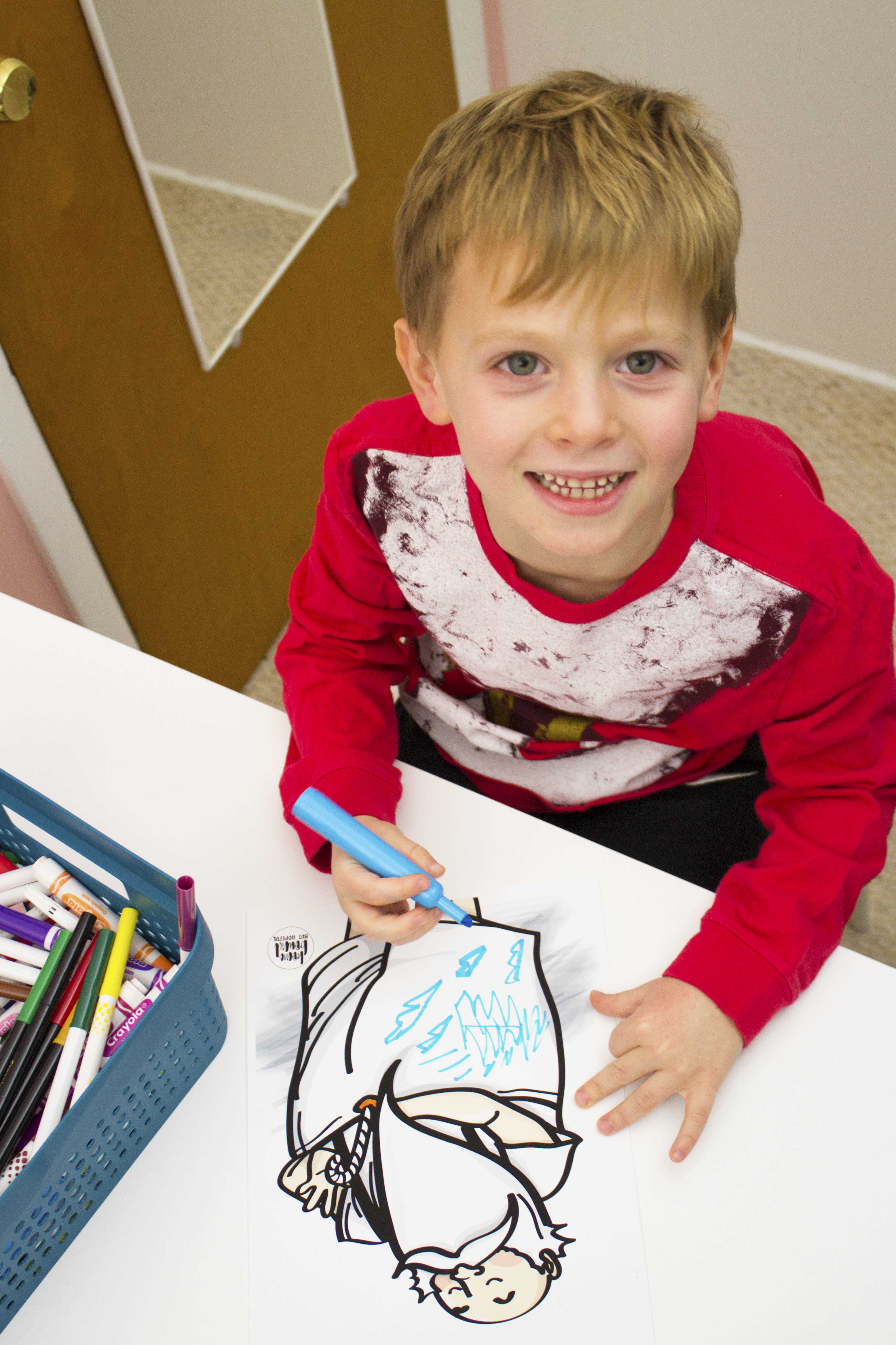 BOY USING MARKER FOR CRAFT