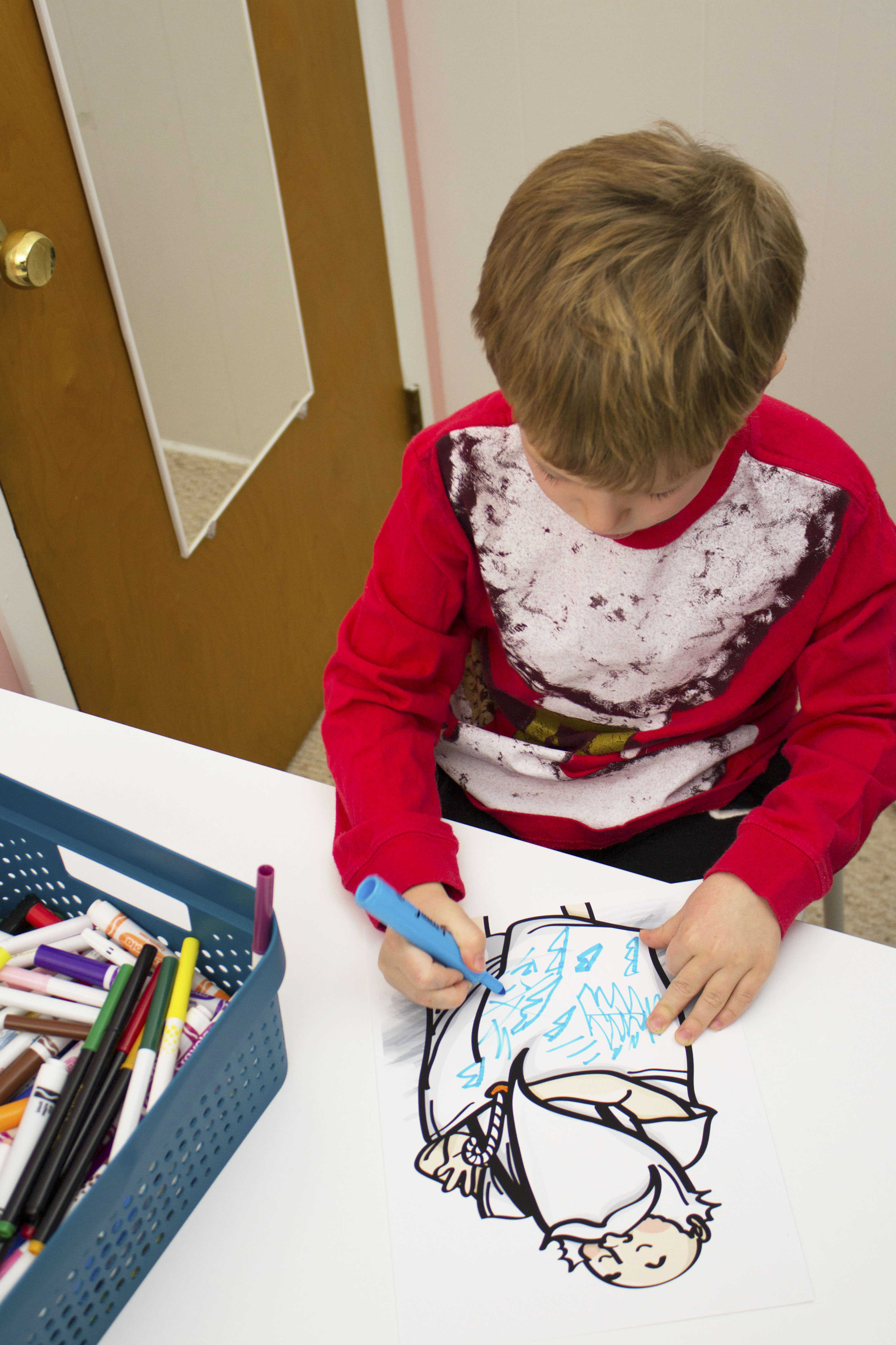 BOY DRAWING WITH MARKER