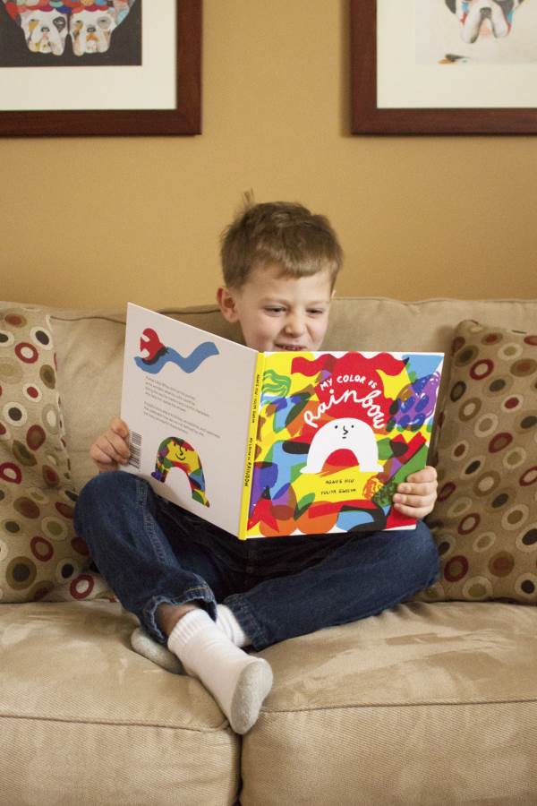 boy reading my color is rainbow