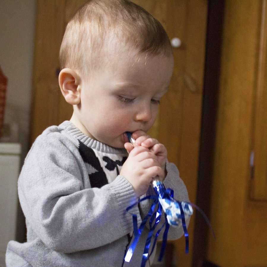 baby with blue horn 