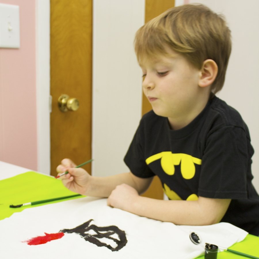 boy painting cape