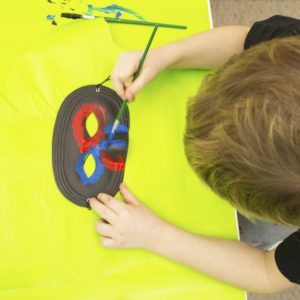 boy painting mask