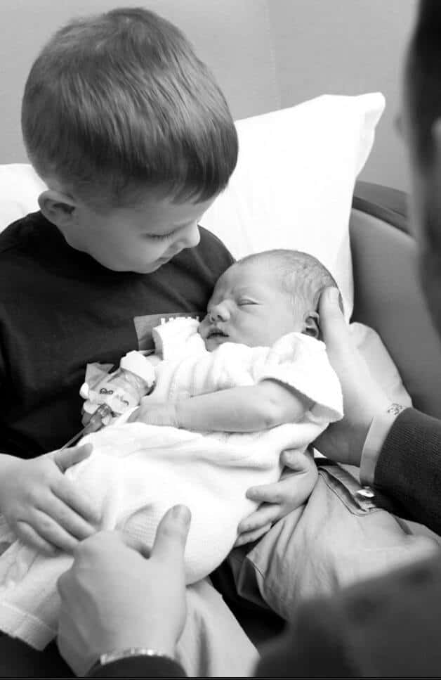 big brother holding baby brother