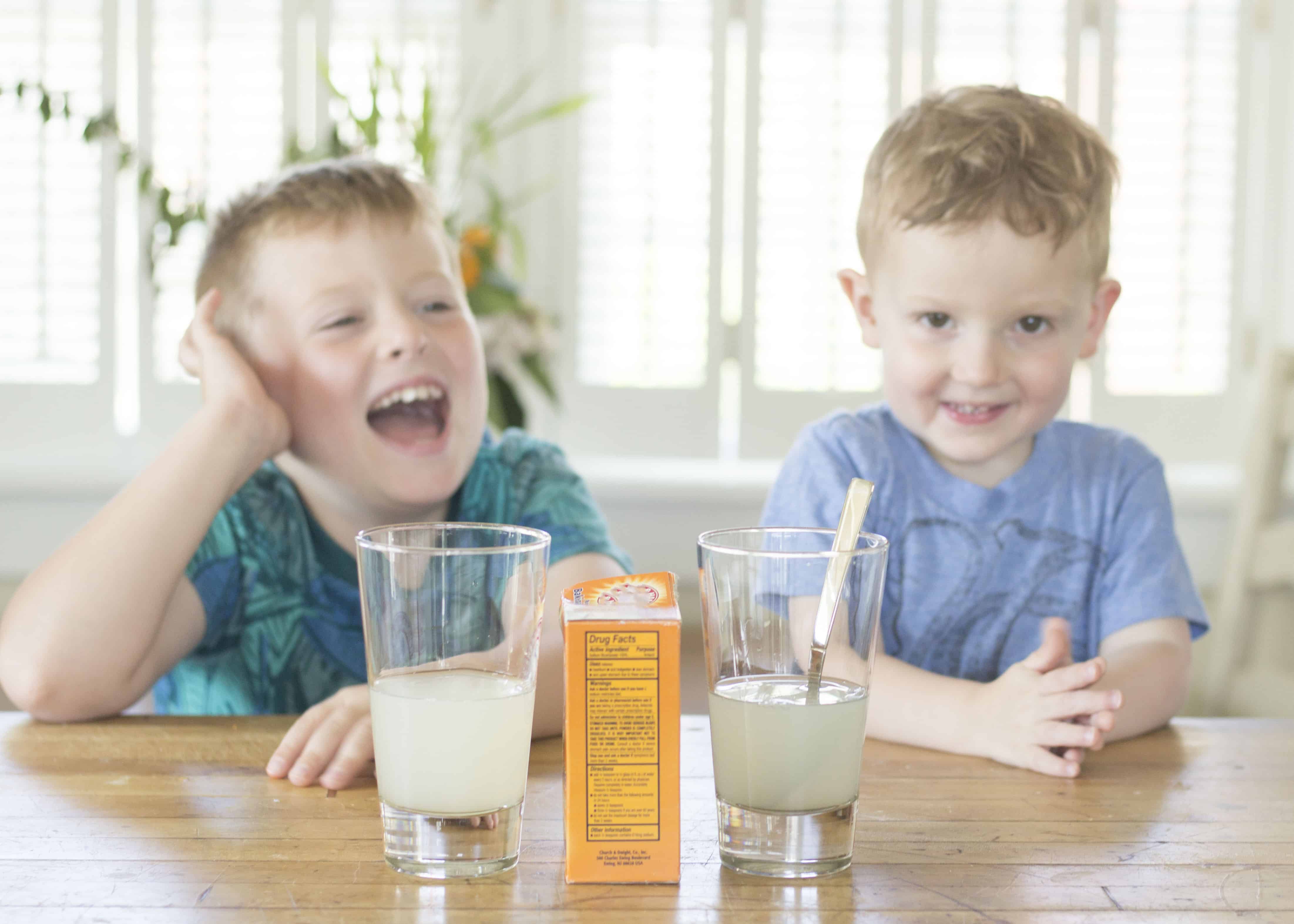 BOYS TASTING LEMONADE