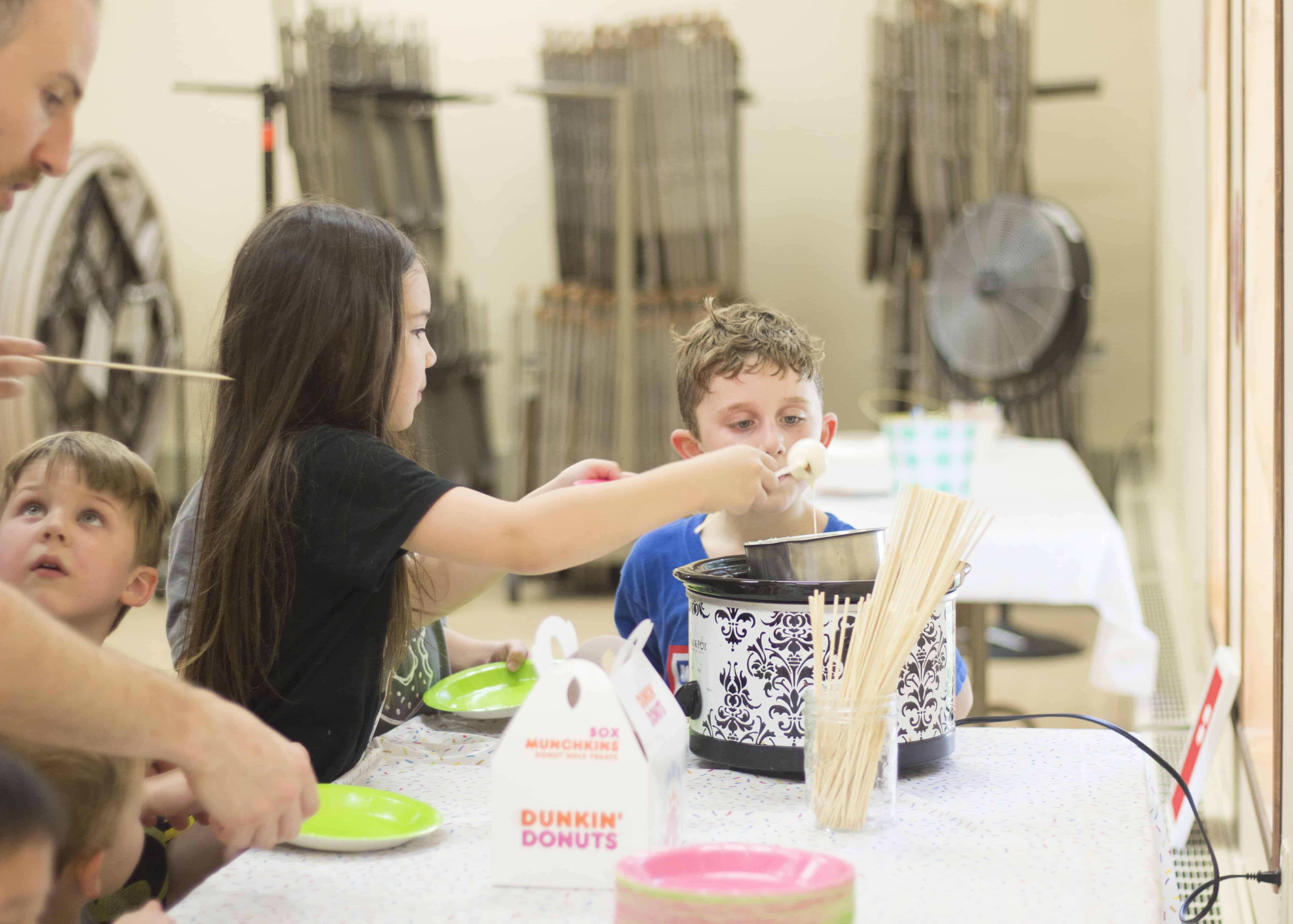 GIRL DECORATING DONUT HOLE