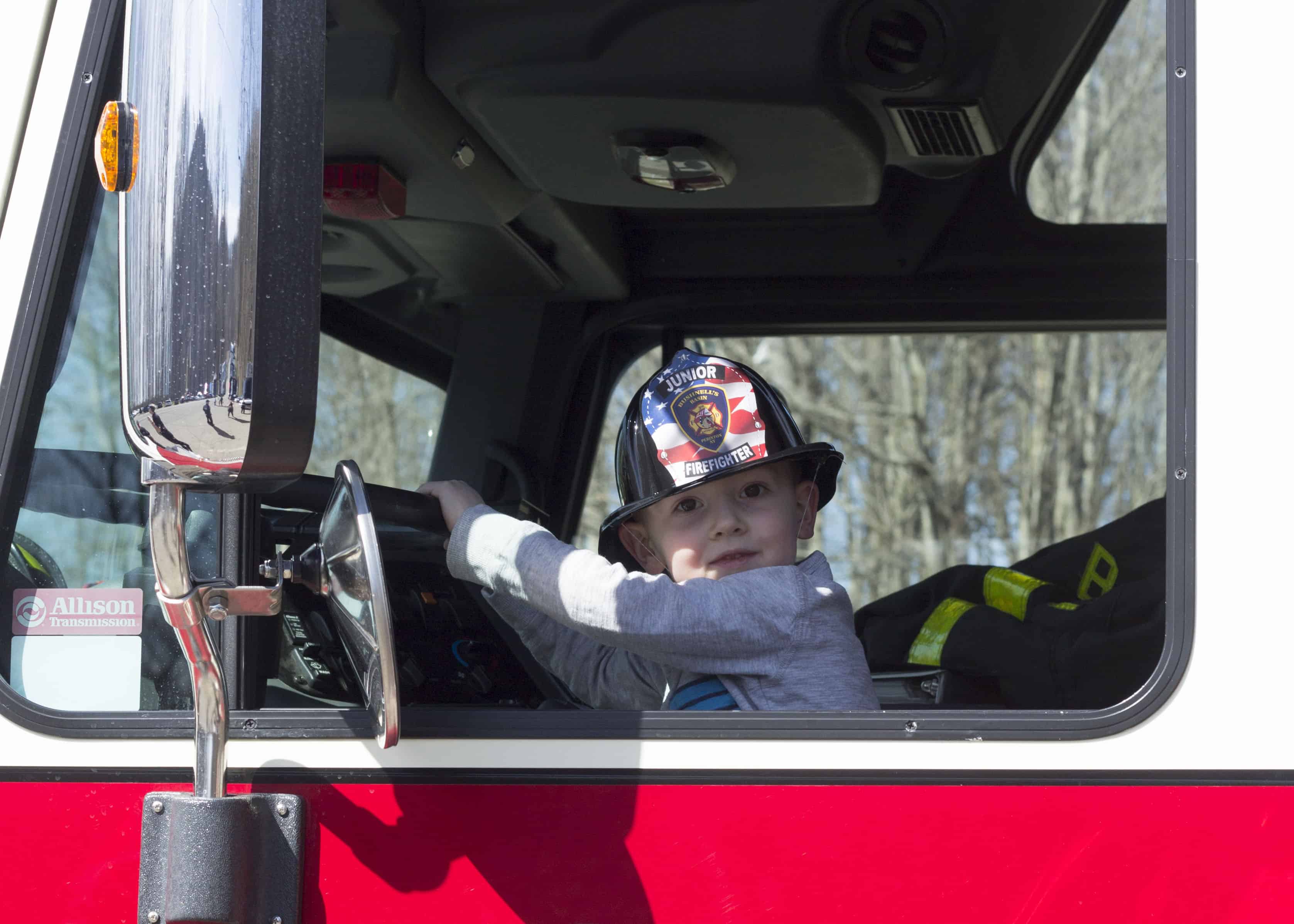 LITTLE BOY IN FIRE TRUCK