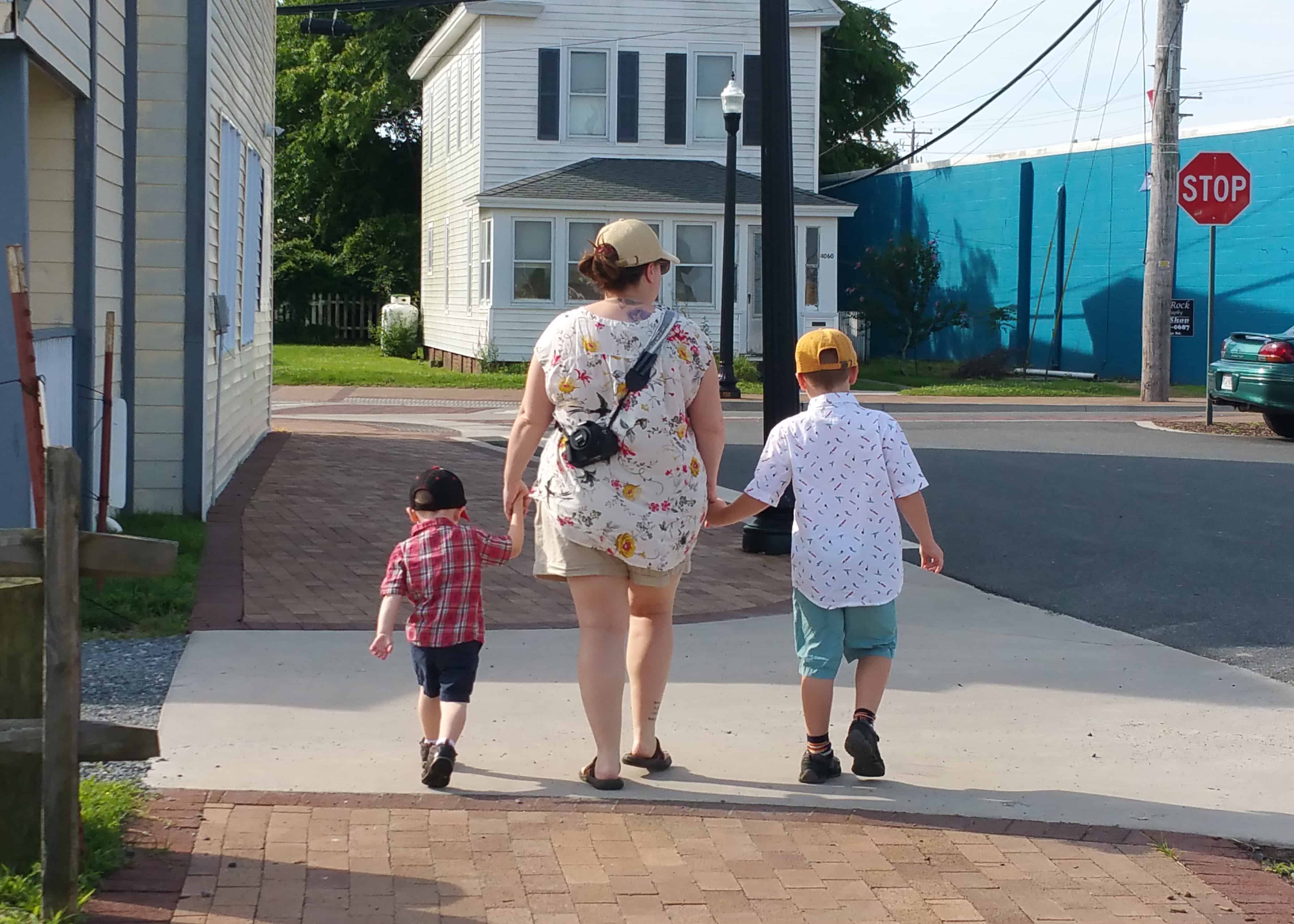 MOM WALKING WITH TWO BOYS