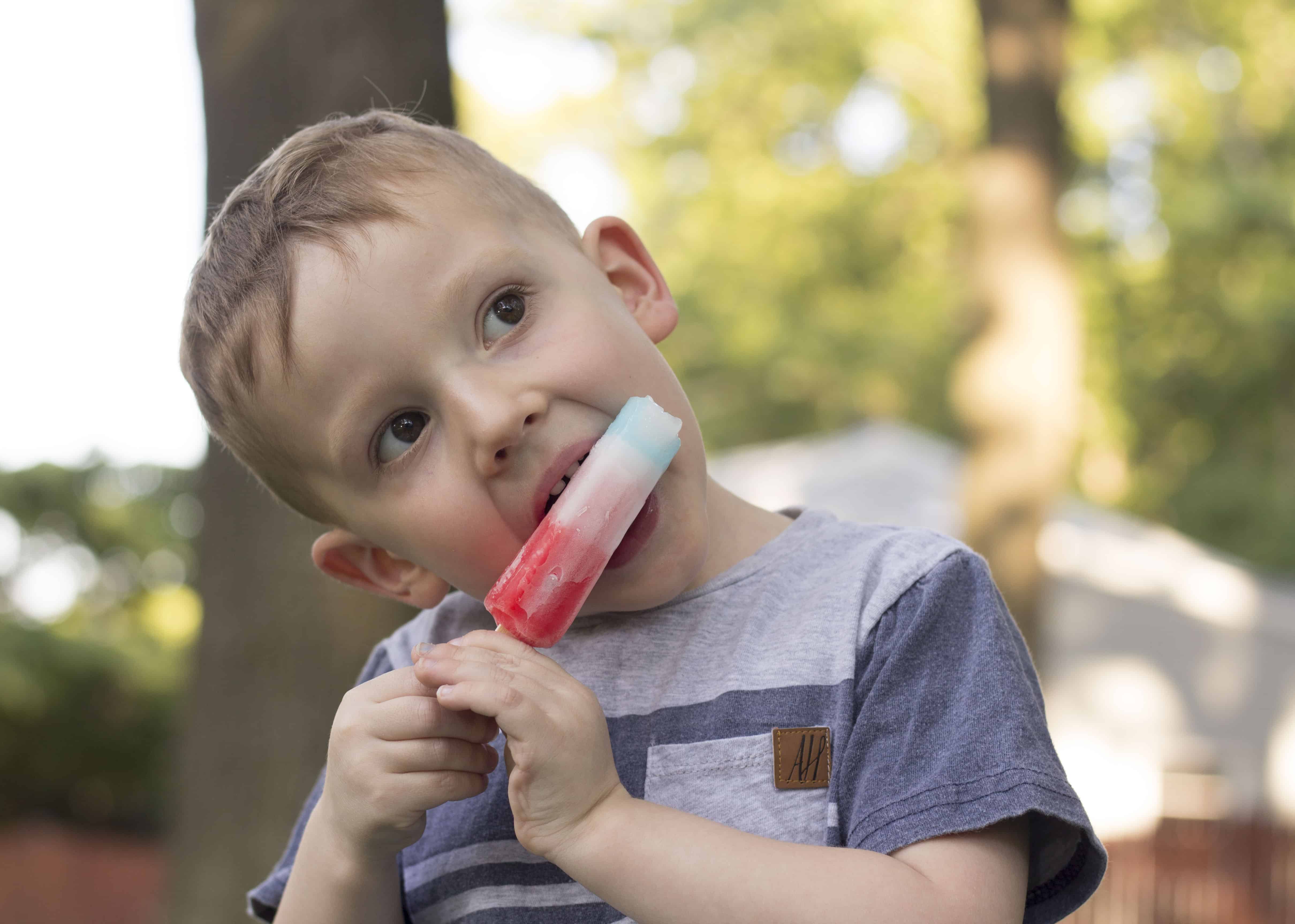 BOY EATING BOMB POP