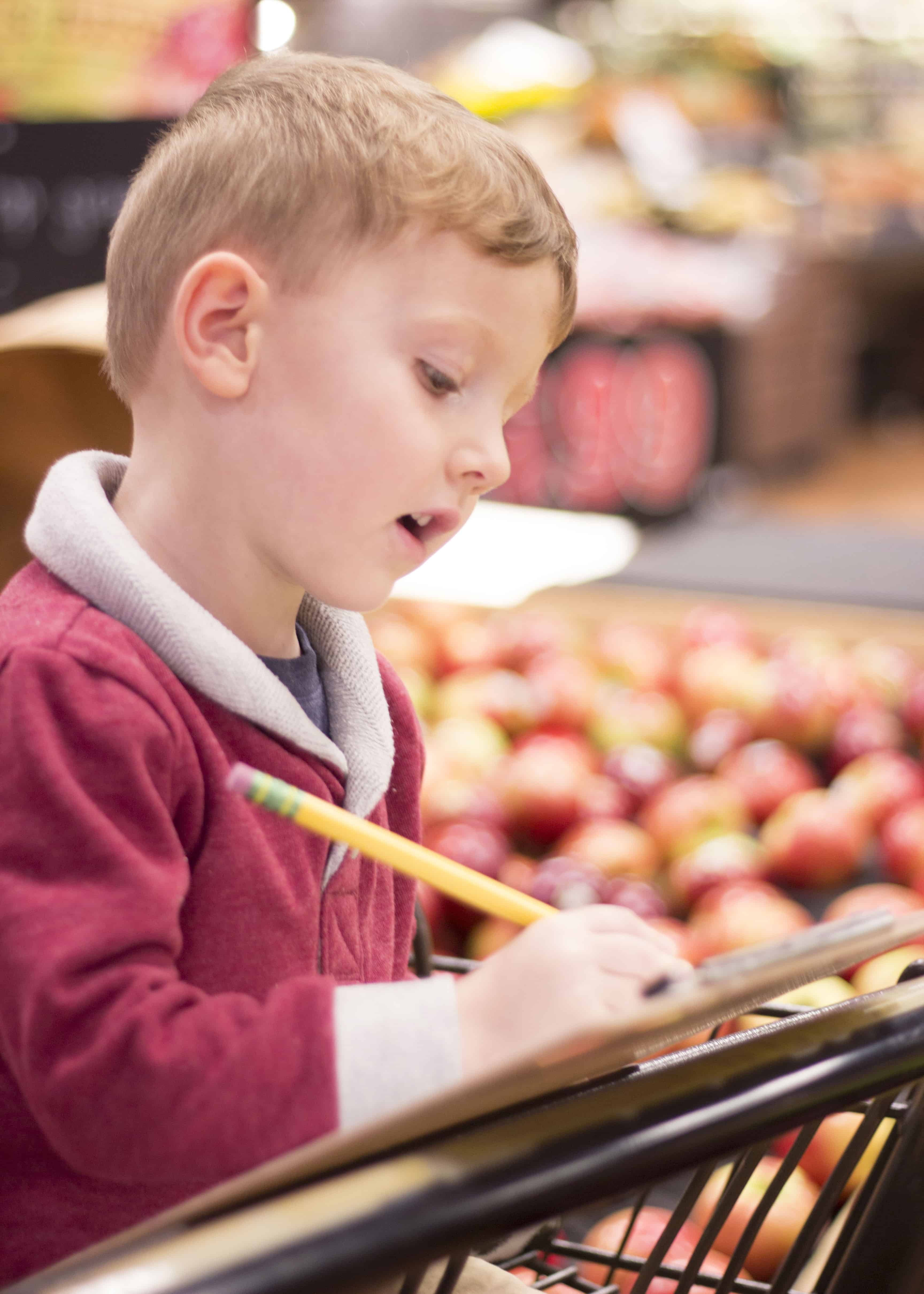 BOY IN GROCERY CART