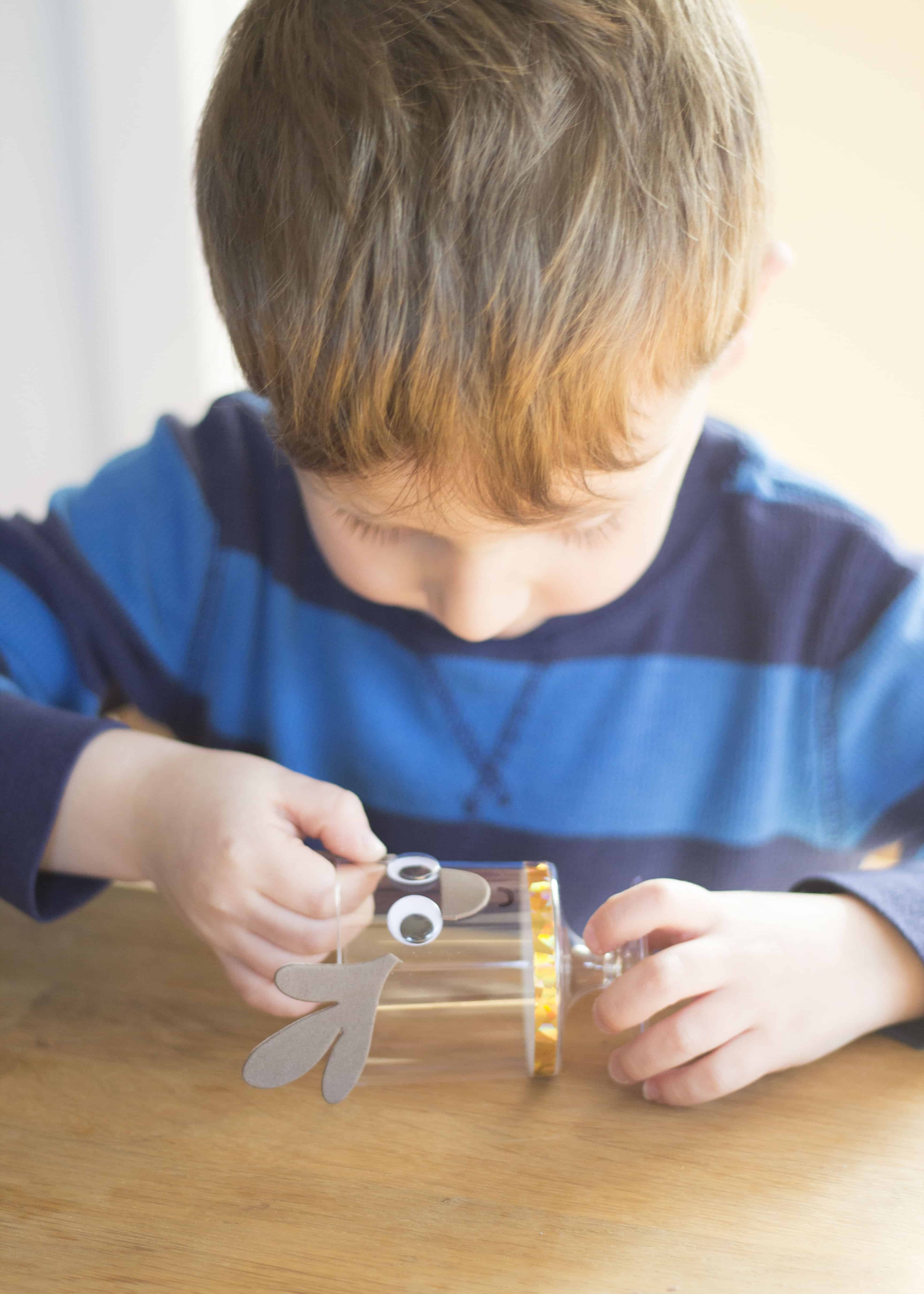 BOY MAKING REINDEER CRAFT