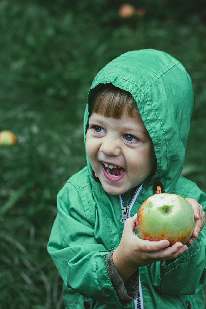 toddler with apple