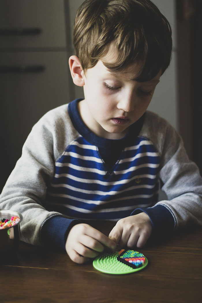 BOY WITH PERLER BEADS