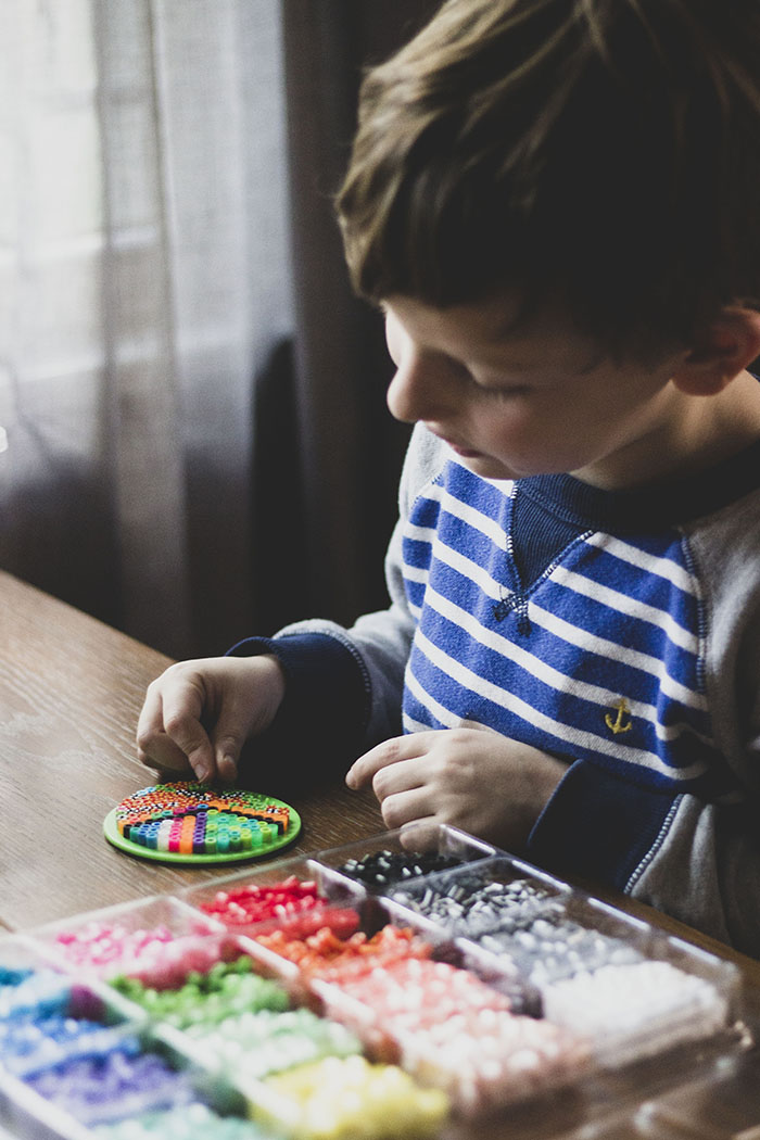 BOY MAKING PERLER BEAD TURKEY