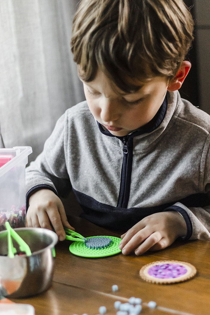 BOY WITH PERLER BEADS